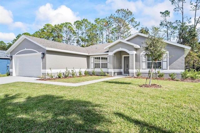 single story home with a garage and a front lawn