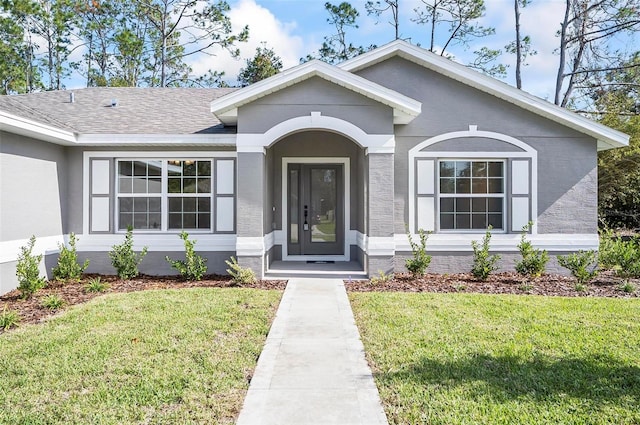 view of front of home with a front lawn