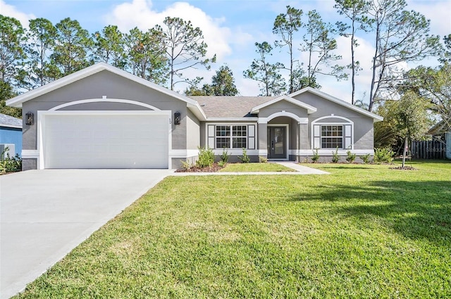 ranch-style house with a garage and a front yard