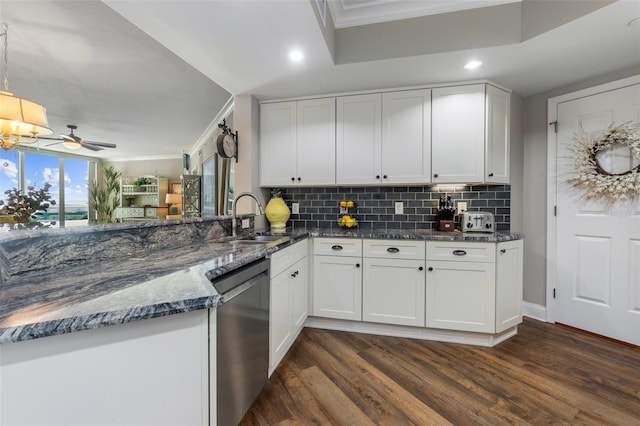 kitchen featuring white cabinetry, sink, dark hardwood / wood-style flooring, and dishwashing machine