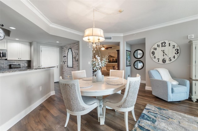 dining area with ceiling fan, ornamental molding, and dark hardwood / wood-style floors