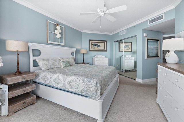 carpeted bedroom featuring a closet, ceiling fan, and crown molding