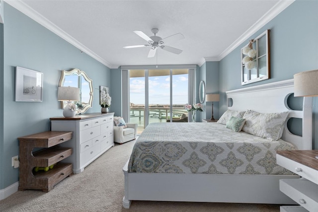 carpeted bedroom featuring ceiling fan, access to outside, expansive windows, and ornamental molding