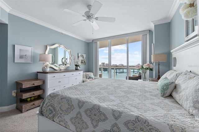 bedroom featuring crown molding, a water view, access to exterior, ceiling fan, and light carpet