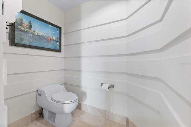 bathroom featuring tile patterned floors and toilet