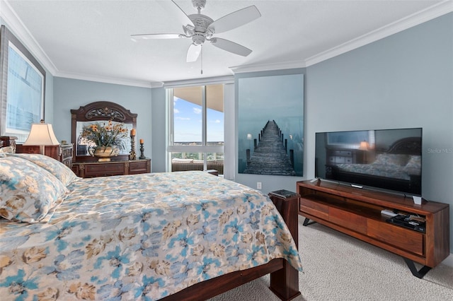 carpeted bedroom with ceiling fan and ornamental molding