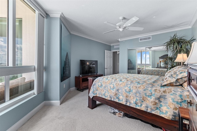 bedroom featuring ceiling fan, ornamental molding, and light colored carpet