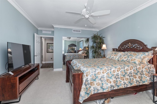 carpeted bedroom featuring ceiling fan and ornamental molding