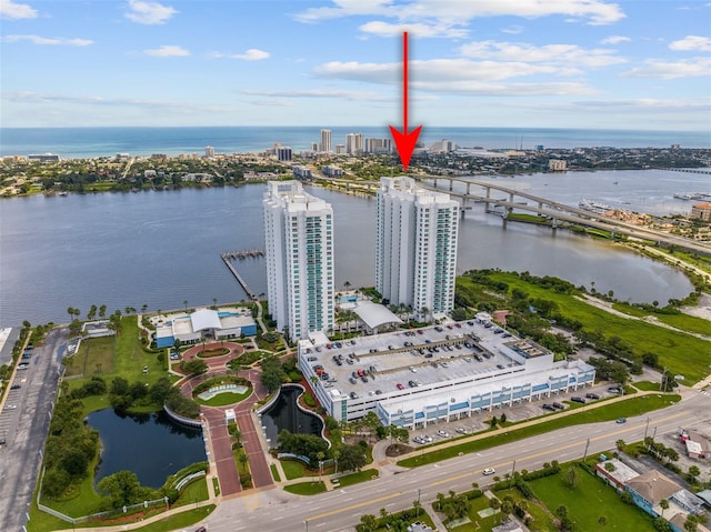 birds eye view of property with a water view