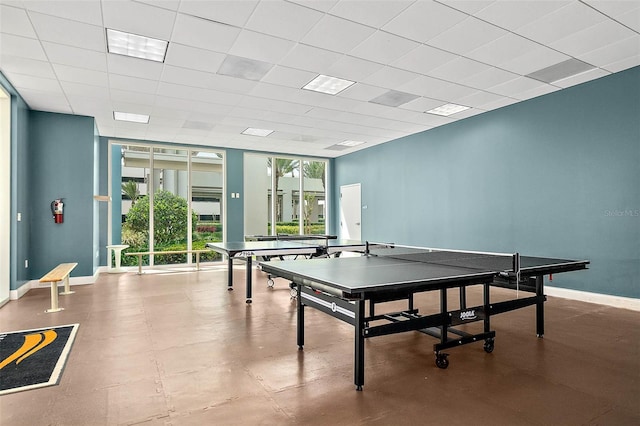 playroom with a drop ceiling and floor to ceiling windows