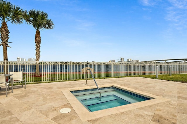 view of pool featuring an in ground hot tub