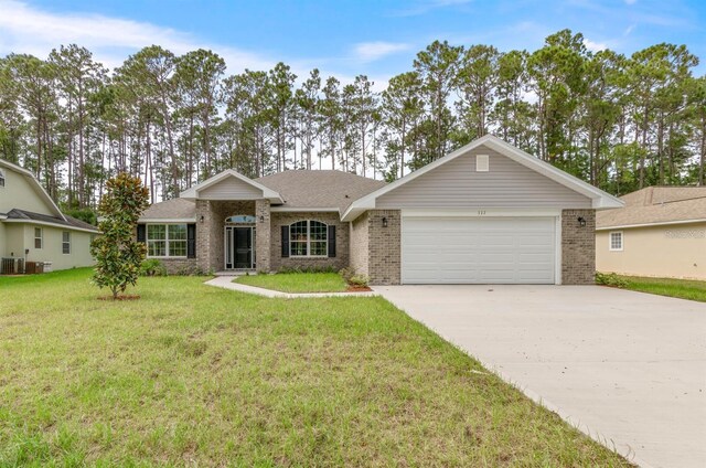 single story home with a garage, central air condition unit, and a front lawn