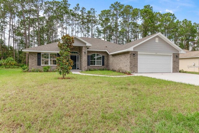 ranch-style home with a garage and a front yard