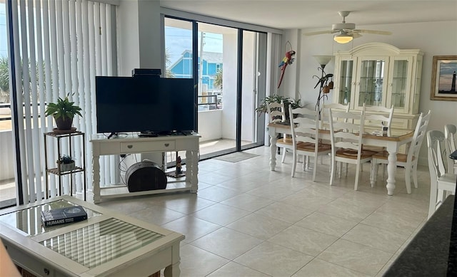 dining area with light tile patterned floors and a ceiling fan