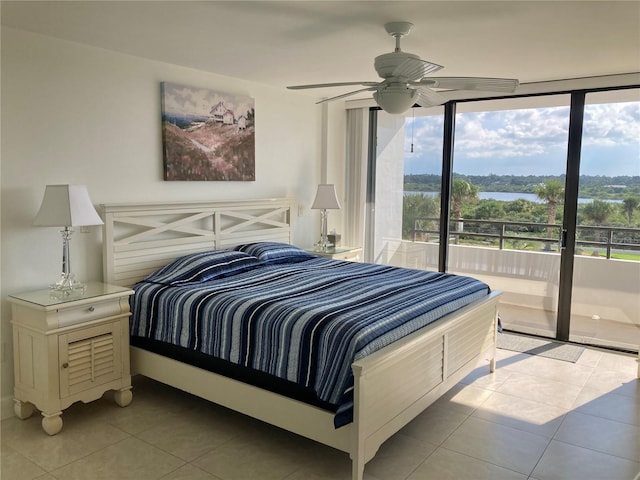 bedroom with ceiling fan, floor to ceiling windows, tile patterned flooring, and access to exterior