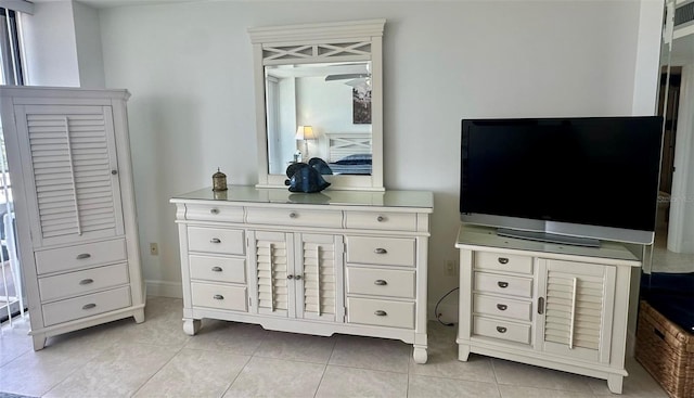 bedroom featuring light tile patterned floors