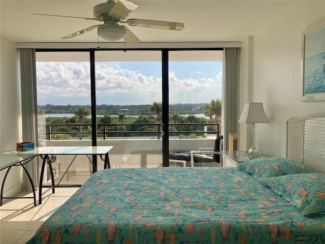 bedroom featuring a ceiling fan, multiple windows, and light tile patterned floors