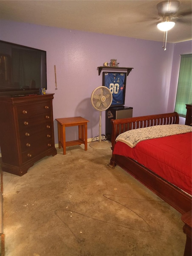 bedroom featuring ceiling fan and concrete floors