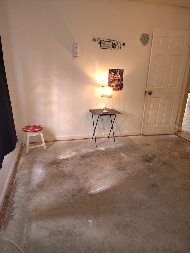 spare room with concrete flooring