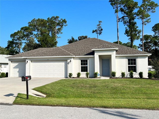 single story home featuring a front yard and a garage