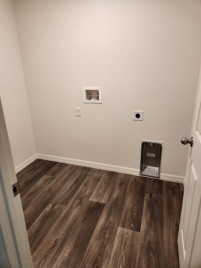 clothes washing area with hookup for an electric dryer, dark hardwood / wood-style floors, and washer hookup