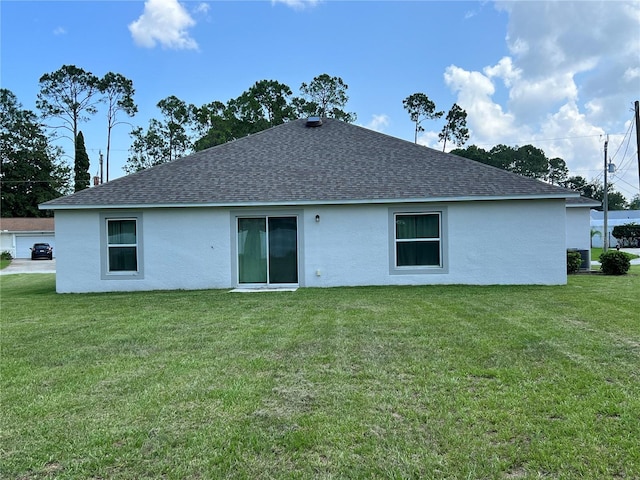 back of property featuring a lawn