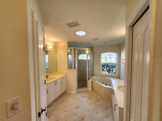 23 Flemington Ln, Palm Coast, FL 32137 - full bathroom with vanity, a stall shower, a whirlpool tub, a textured ceiling, and baseboards