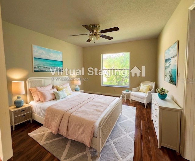 bedroom with a textured ceiling, ceiling fan, and dark wood-type flooring