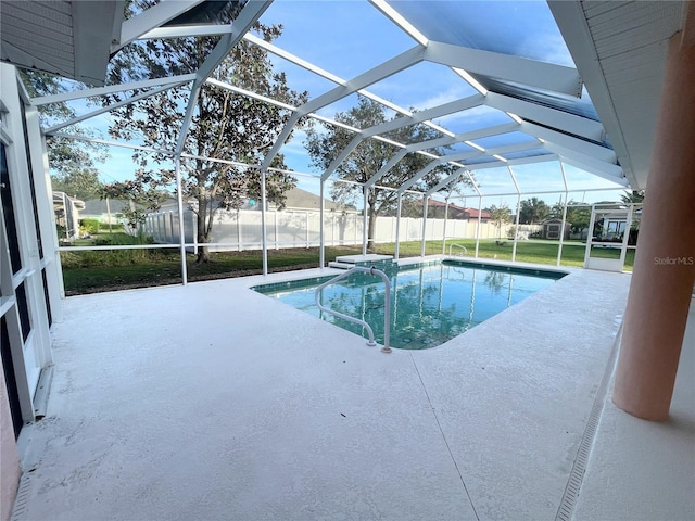 view of pool with a lanai, a yard, and a patio