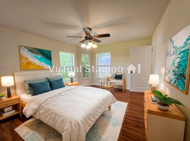23 Flemington Ln, Palm Coast, FL 32137 - bedroom with dark wood-style flooring, a ceiling fan, baseboards, and a textured ceiling