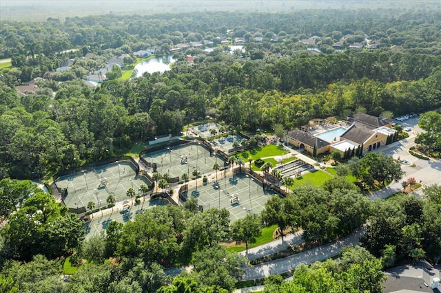 birds eye view of property with a forest view