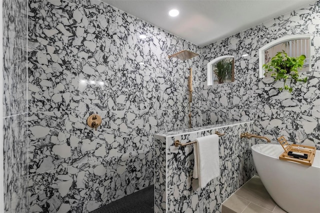 bathroom featuring tile walls, separate shower and tub, and tile patterned flooring