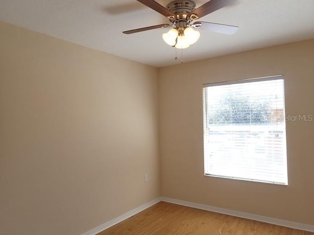 spare room featuring ceiling fan and light hardwood / wood-style flooring