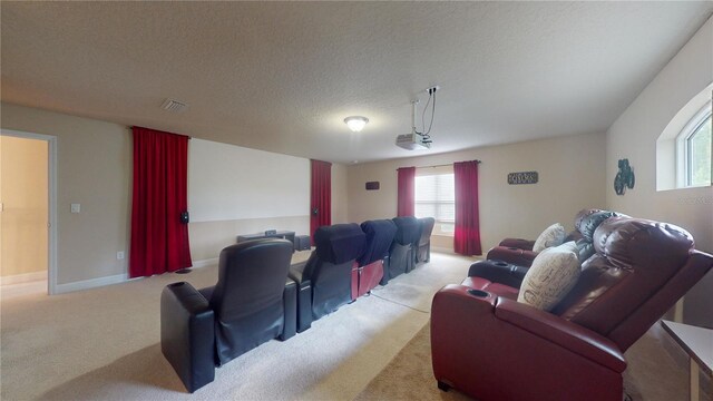 carpeted home theater featuring a textured ceiling