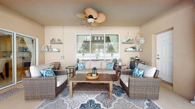 sunroom / solarium with ceiling fan