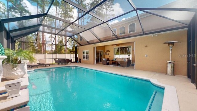 view of pool featuring a patio area and a lanai