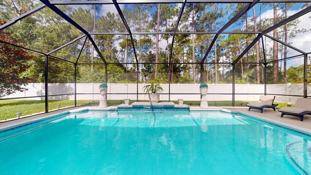 view of pool featuring a patio area and a lanai