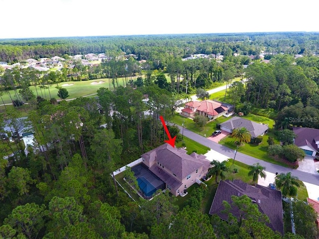 bird's eye view featuring a residential view and a forest view