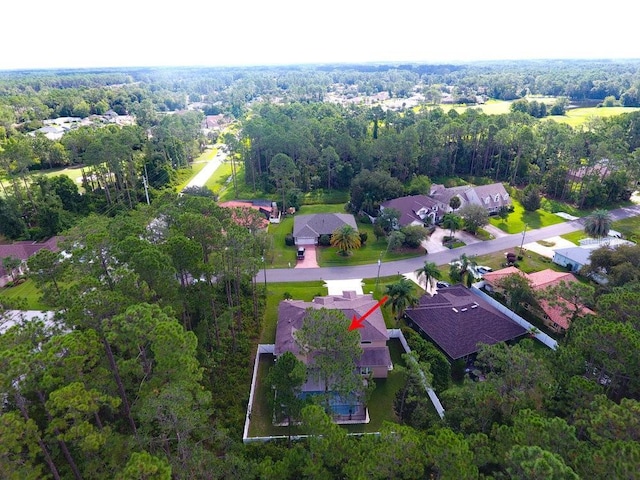 bird's eye view with a residential view and a forest view