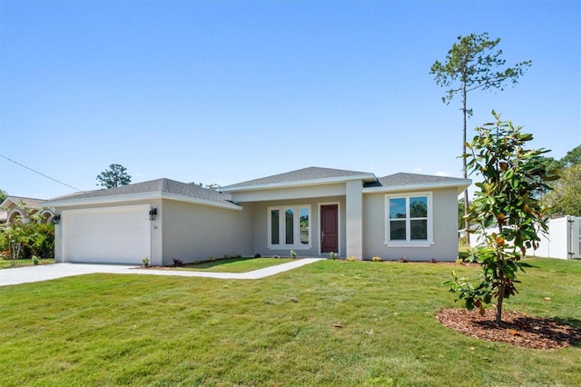 view of front of house with a garage and a front yard