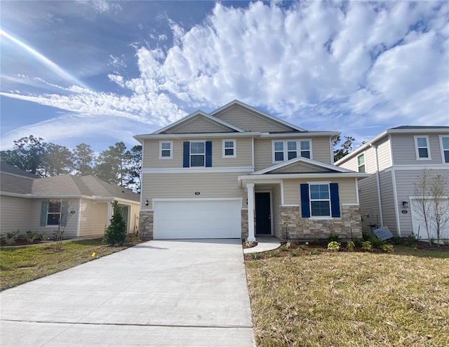 view of front facade with a garage and a front lawn