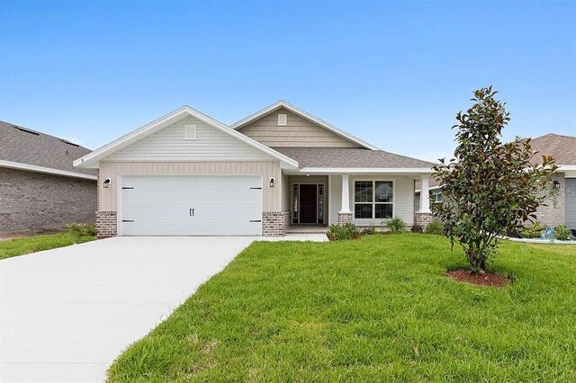 craftsman-style home featuring a garage and a front yard