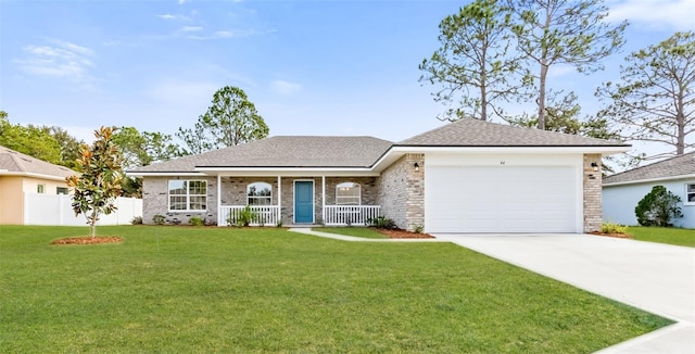 single story home featuring a garage, a front lawn, and a porch