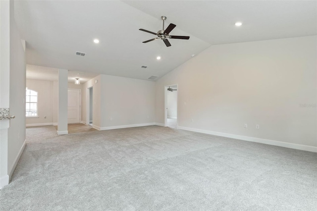 spare room featuring ceiling fan, light carpet, and high vaulted ceiling