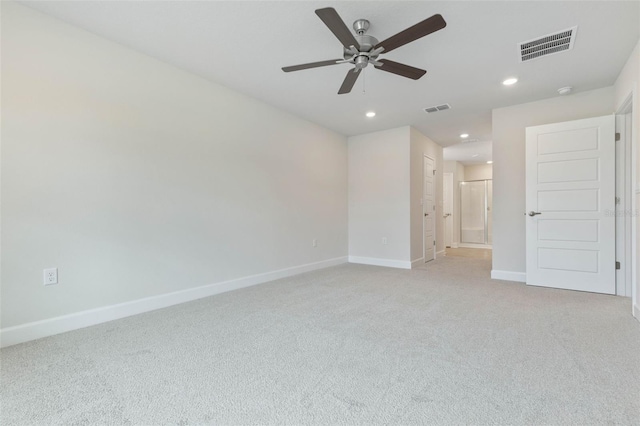 unfurnished bedroom with ceiling fan and light colored carpet