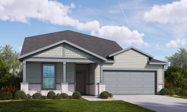 view of front of home featuring a front lawn and a garage