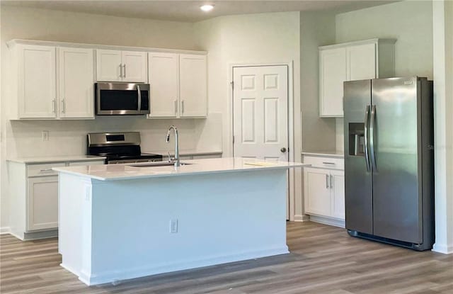 kitchen featuring white cabinetry, appliances with stainless steel finishes, and light hardwood / wood-style floors