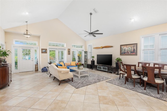 living area featuring light tile patterned floors, ceiling fan, high vaulted ceiling, and french doors