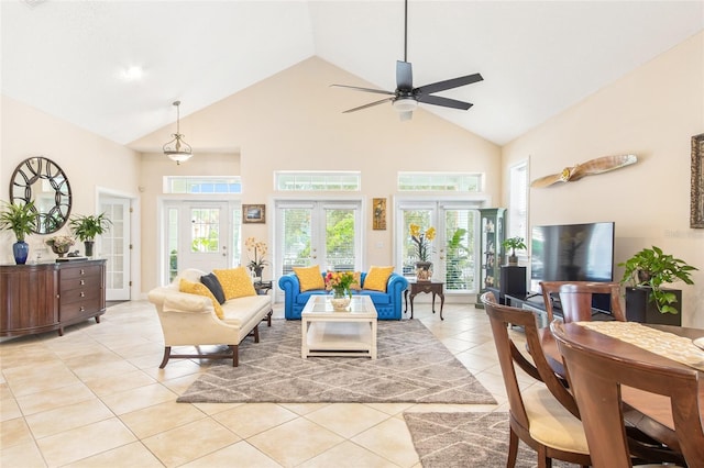 living area featuring high vaulted ceiling, a ceiling fan, french doors, and light tile patterned floors