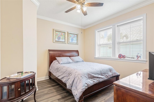 bedroom featuring ceiling fan, crown molding, baseboards, and wood finished floors